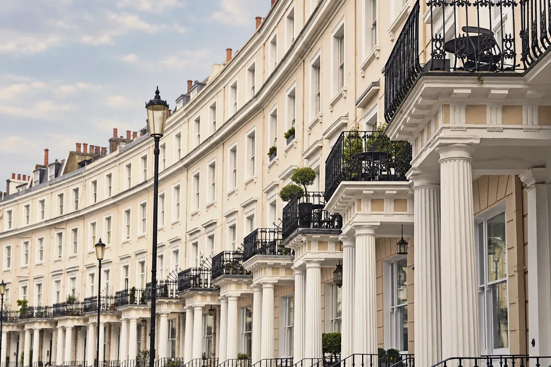 Brick and stone facade of a well-kept London terrace